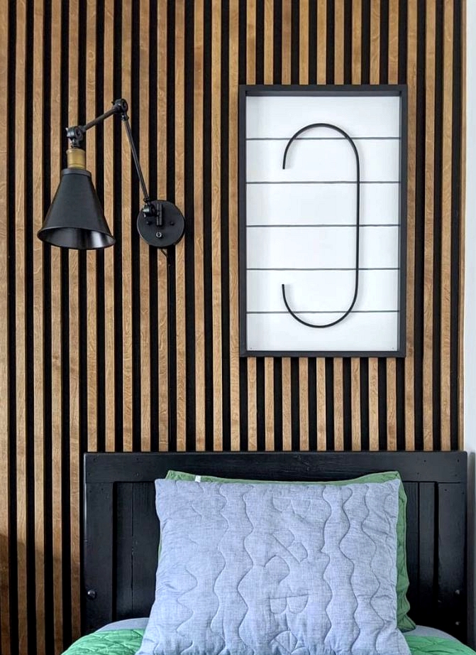 Budget friendly accent wall ideas black and wood slat wall.