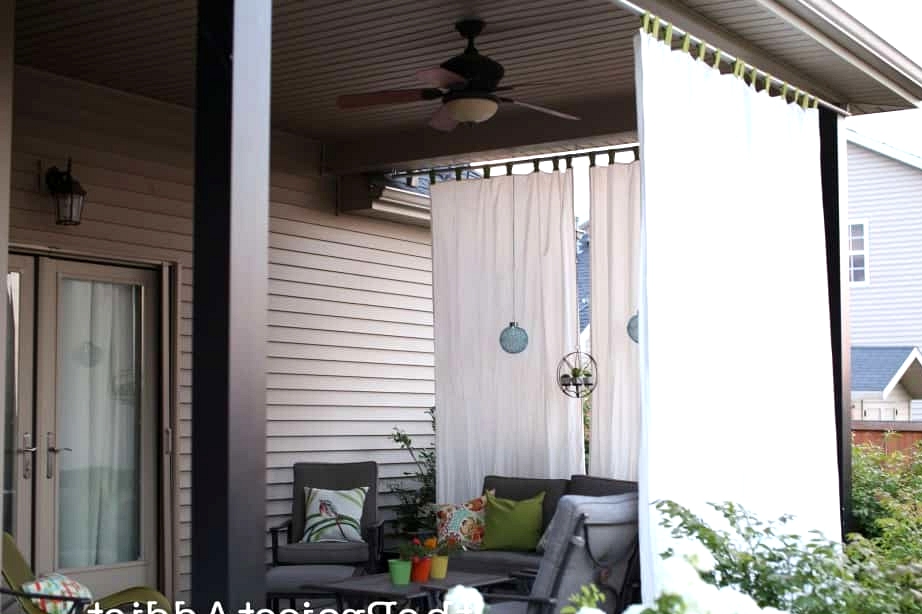 Hang Some Outdoor Curtains Around the Porch