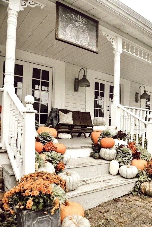 Piles of pumpkins and gourds are perfect for decorating a front porch for fall