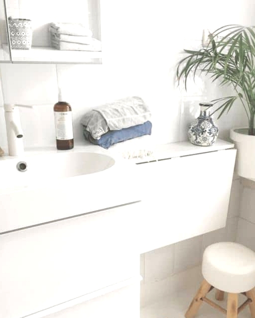A Fold-Down Shelf Is Useful for Smaller Bathrooms