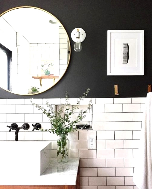 Black grout to match a painted black wall in a farmhouse bathroom