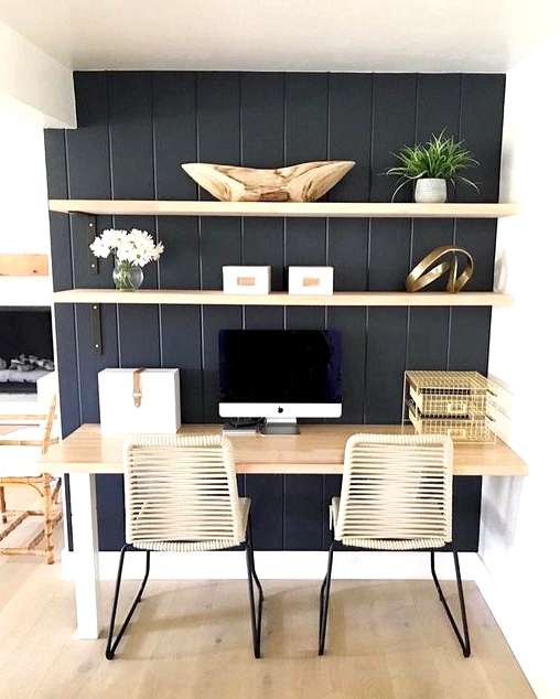 Small corner turned home office with a black accent wall