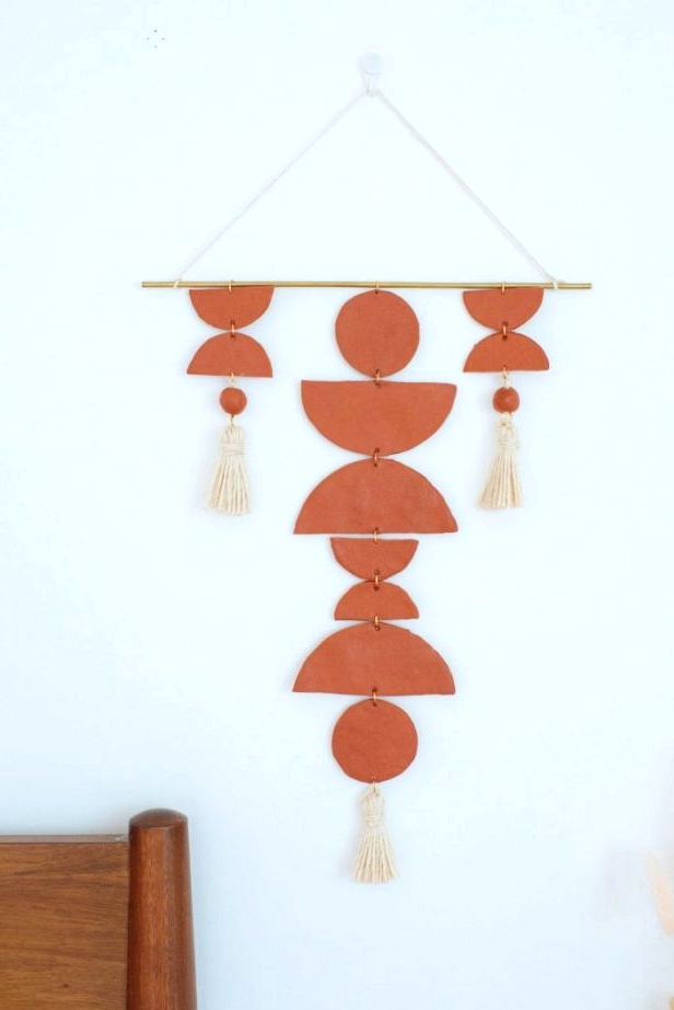 Boho clay wall hanging DIY decor in a terracotta color. 