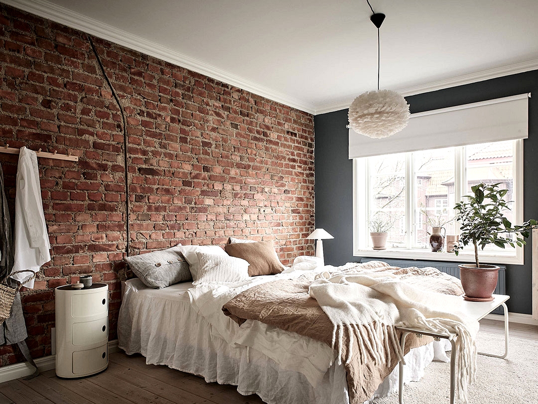 Brick wall and delicate interiors: apartment in 1915 building in Goteborg (66 sqm)