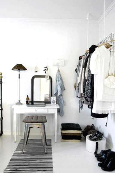 a makeshift closet is a very cool idea for a bedroom, you may show off your clothes and shoes making them part of decor and it doesn't look bulky