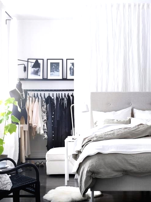 a makeshift closet hidden with a large white curtain - you get two airy spaces that can be separated with a curtain or merged anytime