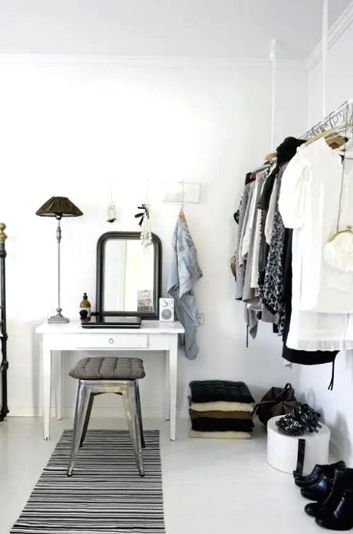 a hanging rack on white ribbons looks ethereal as if it's floating in the air and doesn't clutter the space a lot
