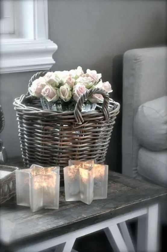 star-shaped candle holders, a baskets with blooms for decorating the space in farmhouse style
