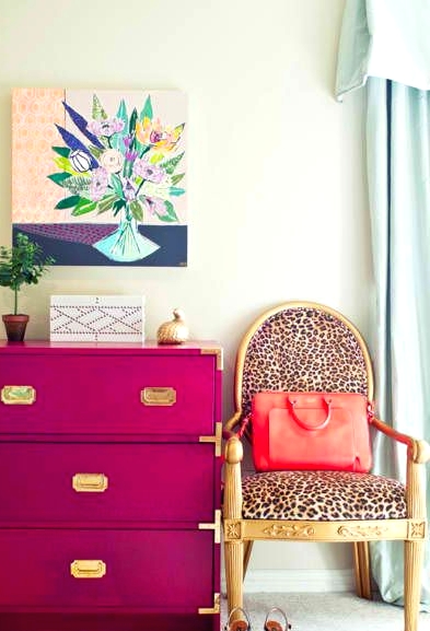 a glam and girlish space with a fuchsia dresser, a leopard print chair, a bold artwork and some cool decor is wow