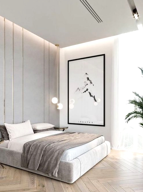 a chic minimalist bedroom in neutrals, with built-in lights, a statement artwork, pendant lamps and potted plants