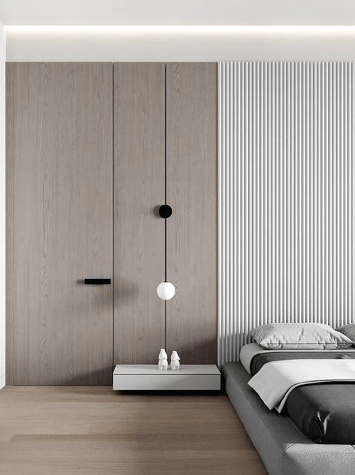 a minimalist bedroom with a plywood and wood slab wall, a grey upholstered bed, a white floatign nightstand and some lamps