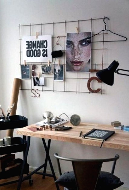 a contemporary meets industrial home office with a wire holder, an IKEA Raskog cart, a metal and wood desk plus a metal chair