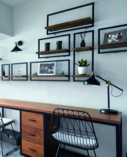 a contemporary-style shared home office with industrial furniture - a metal and wood desk, metal chairs, metal and wood open shelving