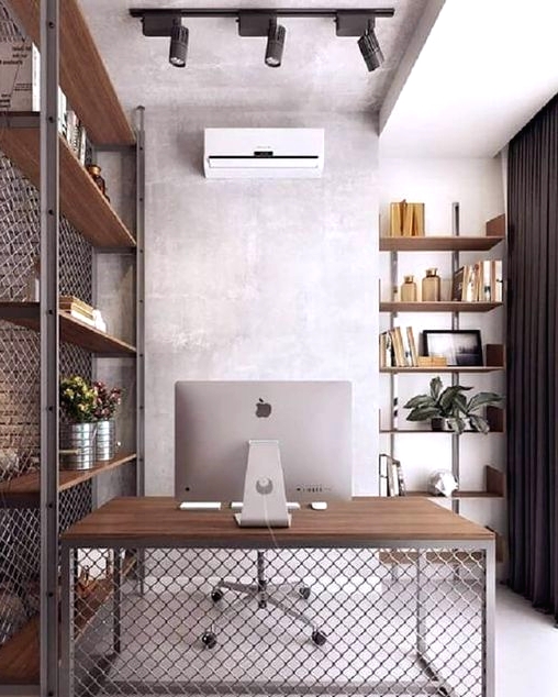 an industrial working space with a metal shelving unit as a space divider, a matching desk, built-in shelves and spotlights on the ceiling