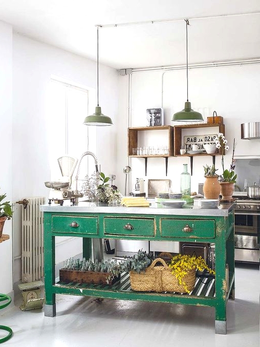 a vintage kitchen with open shelves instead of cabinets, stainless steel appliances, a green kitchen island of wood