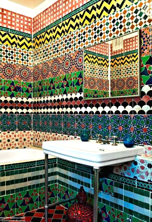an Eastern bathroom clad with colorful printed tiles all over looks incredible, this is a real Eastern oasis, just add vintage Moroccan lanterns