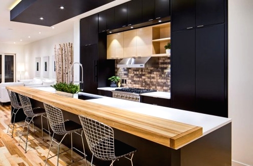 a good-looking black kitchen with an island
