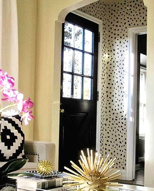 a beautiful entryway accented with Dolmatin wallpaper, which is a bold and out of the box idea to rock, add pattern to the space