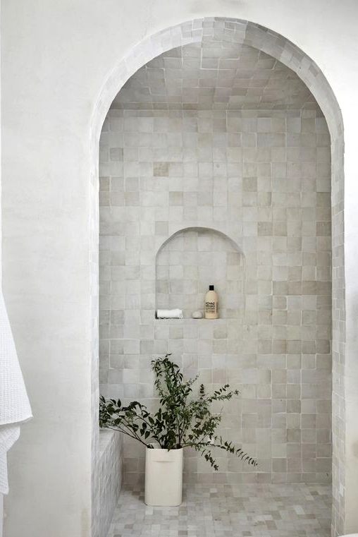 a stylish shower space with creative tiles
