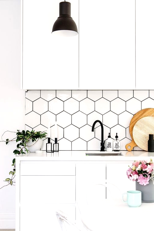 a white Scandinavian kitchen with a bit of black touches for a contrast and hex tile sticker panels on the backsplash to make it more awesome