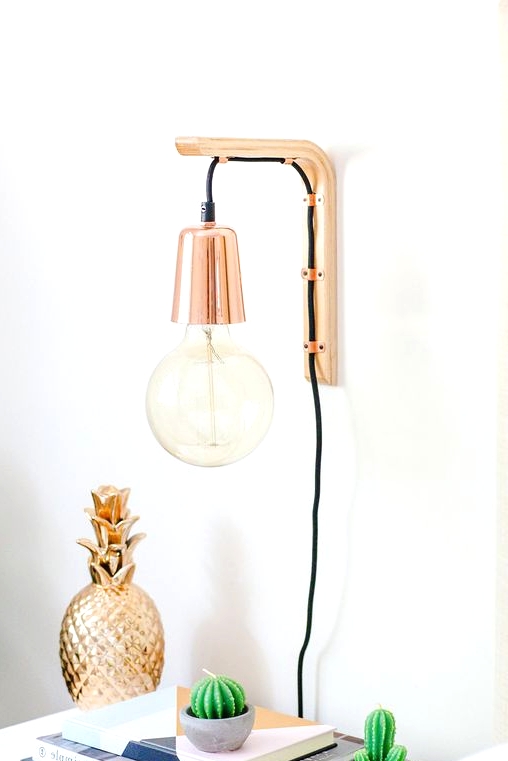 such a lovely modern sconce with a touch of copper will add a cool touch to your bedroom and will let you read comfortably