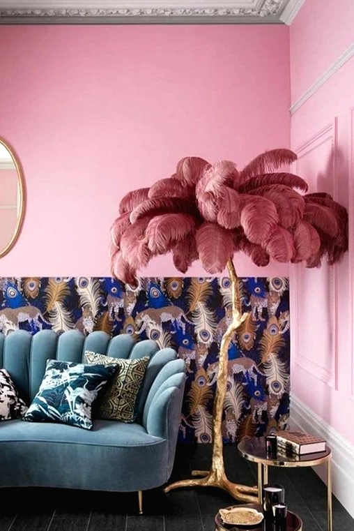this bold and kitschy lamp will make your space jaw-dropping, it's a gilded branch lamp with dusty pink feathers