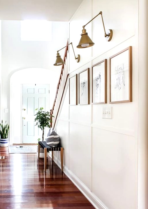 accent your mini gallery wall with elegant vintage brass sconces and your artwork will be always seen