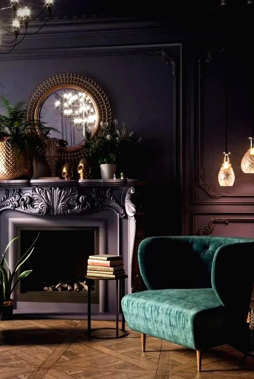 a beautiful vintage living room with a purple accent wall with molding, a fireplace, potted plants and blooms, a chandelier and a green chair