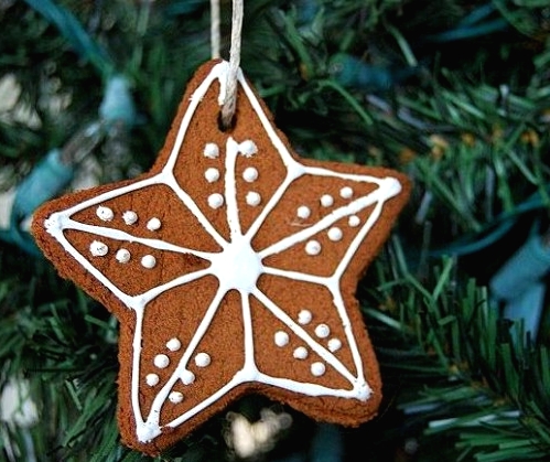 a glazed gingerbread Christmas star cookie is a pretty decoration or an ornament for the holidays