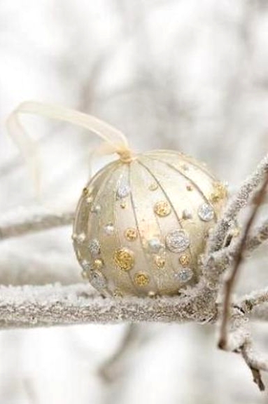 a refined and glam Christmas ornament with gold and silver detailing is a chic and beautiful solution for the holidays