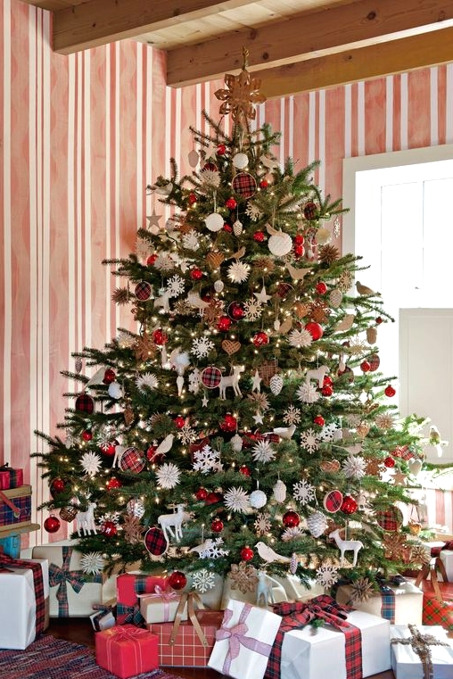 a bright Christmas tree with white and red ornaments, deer and bird figurines, snowflakes and plaid ornaments is a fun and bold idea