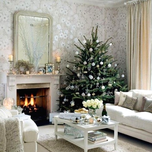 a delicate Christmas tree decorated with white and sheer ornaments is a chic and cool idea for a modern space with a touch of glam
