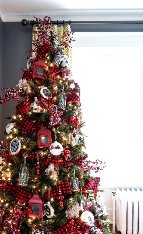 a super bright Christmas tree with lights, chalkboard and red lantern ornaments, bells, trees and berries plus plaid ribbons