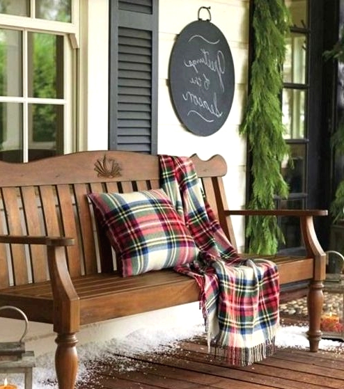 plaid blankets and pillows are great to instantly turn your space into a holiday one, whether you are rocking them indoors or outdoors