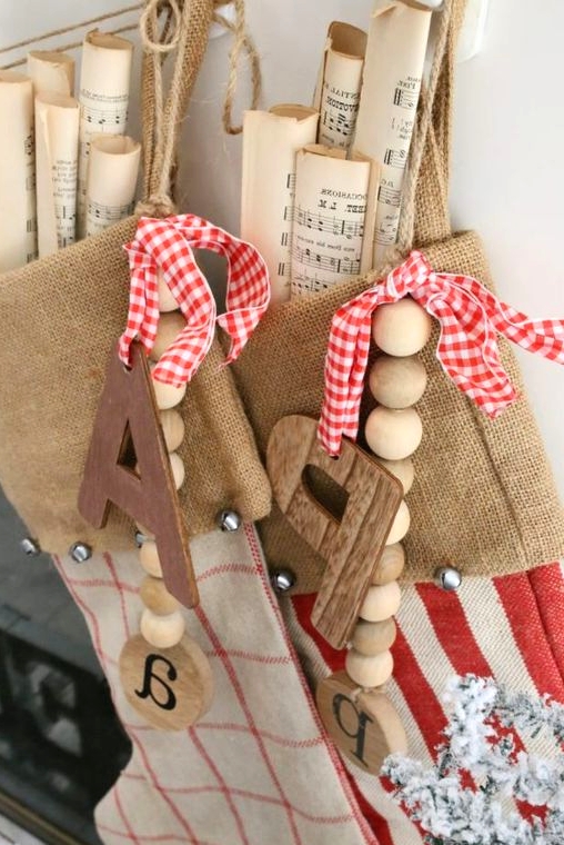 burlap stockings with wooden beads and monograms, plaid bows and vintage note paper are amazing for vintage Christmas spaces