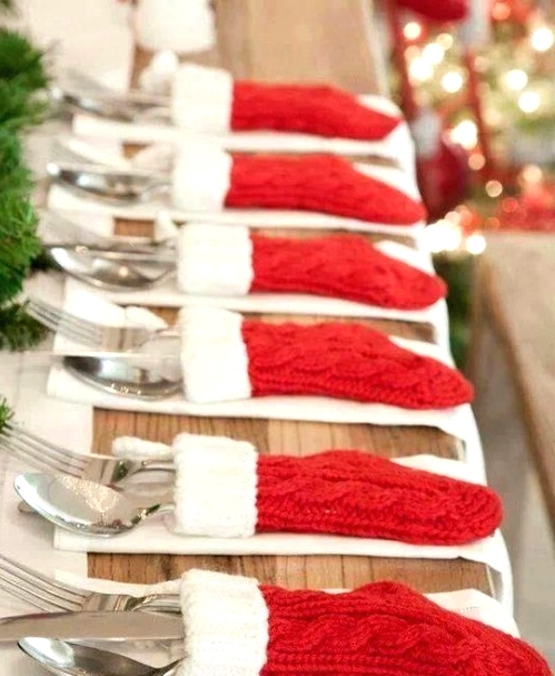 little knit red and white stockings as cutlery pockets are very whimsy, fun and cool and will make your Christmas tablescape amazing