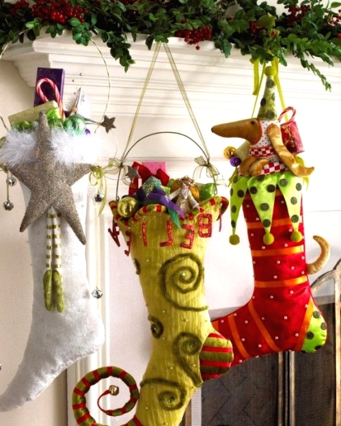 crazily colorful elf-shaped stockings with bright decor, detailing and appliques for a bright and fun touch in the space