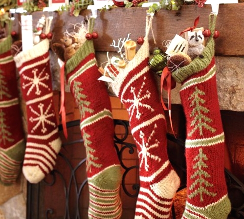 red, green and white knit stockings are pretty traditional decor at Christma,s you can hang them anywhere, though a mantel is the most popular place