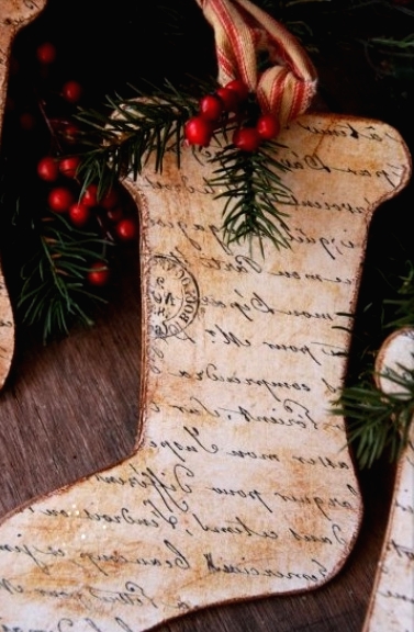 cardboard Christmas stockings with calligraphy, evergreens and berries are amazing Christmas ornaments that you can DIY