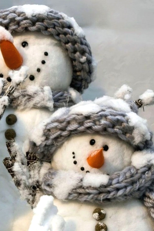 pretty cotton snowmen with branches and in cozy grey scarves and beanies look awesome and will be nice decor for both outdoors and indoors