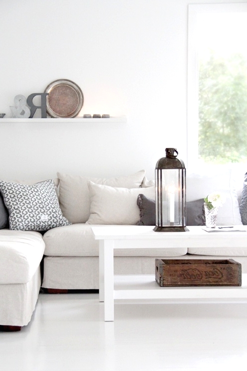a cozy scandi living room design with a sectional sofa