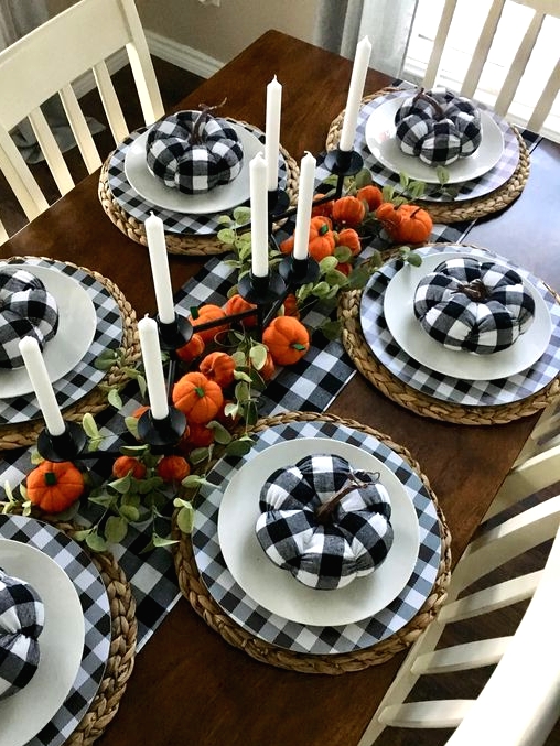 buffalo check plates, white ones and woven placemats for a modern farmhouse Thanksgiving table with bold touches