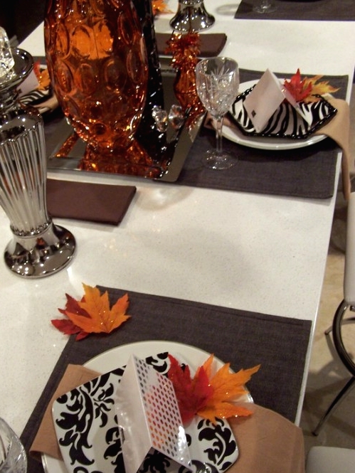 a round white plate and a square black and white printed plate for a more modern and unusual look for Thanksgiving