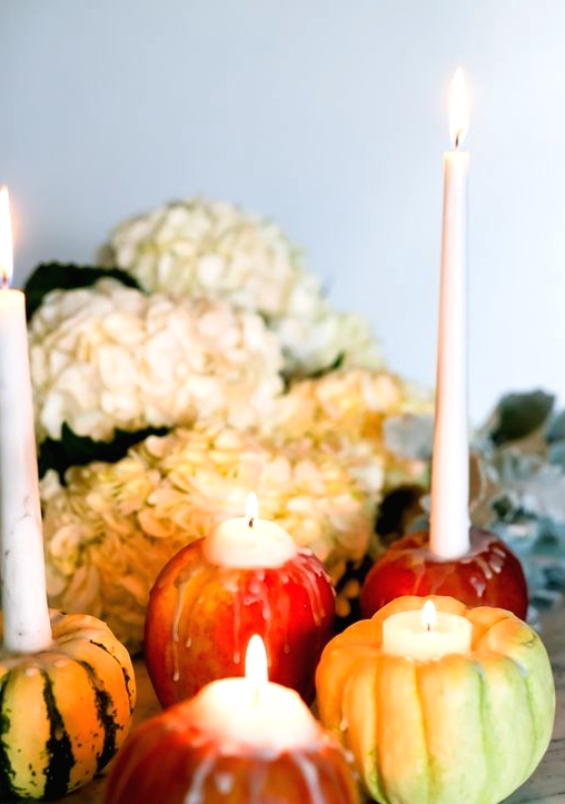 mini pumpkins and apples as candleholders are perfection for Thanksgiving and will add a natural feel to the space