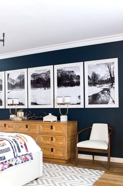 a lovely modern gallery wall with matching white frames and black and white photos of the same place but as a panorama