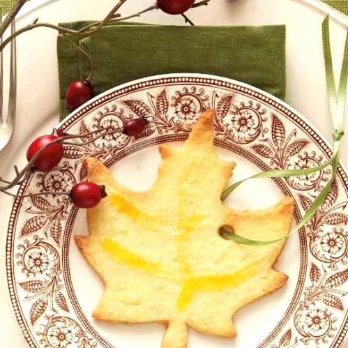 a pretty maple-leaf shaped cookie with a ribbon is a great idea to mark each place setting and to give it as a party favor at the same time