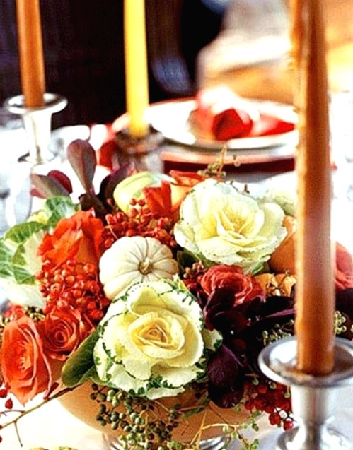 a bright Thanksgiving centerpiece of neutral and orange blooms, pumpkins, greenery, berries and dark foliage is a cool idea for Thanksgiving