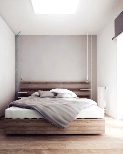 a small minimalist bedroom with a stained floating bed with a planked headboard and floating nightstands, pendant lamps and a skylight