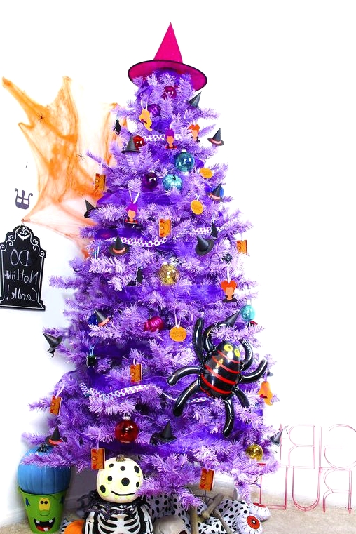 a bright purple Halloween tree with colorful ornaments and pumpkins, a witch hat and a spider is all fun