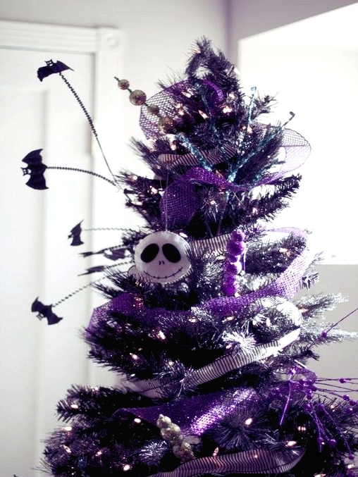 a purple Halloween tree with matching ribbons, Jack Skellington head, bats and lights is a gorgeous idea to rock at Halloween